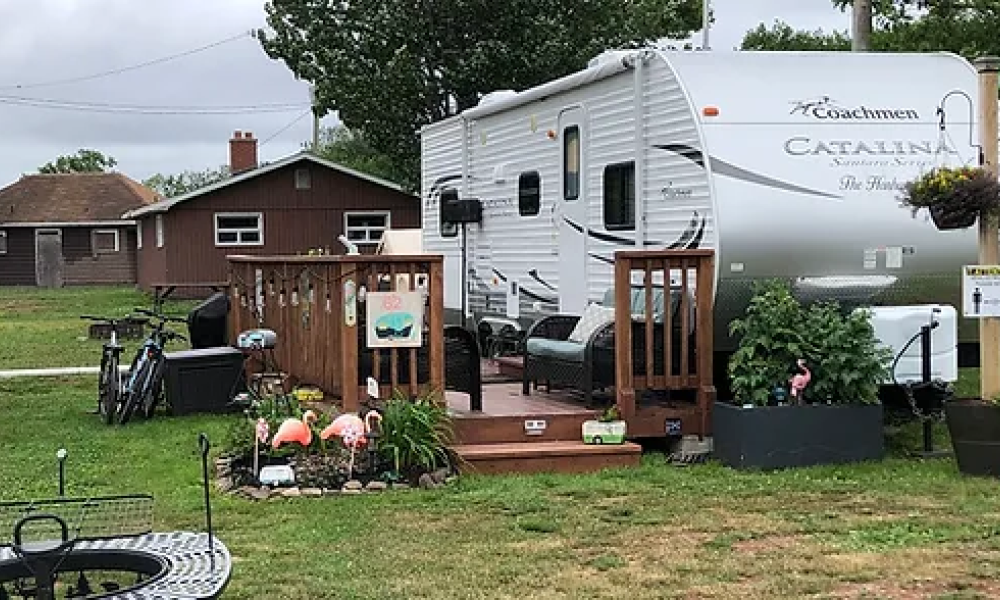 an RV with a nice fence and decorations